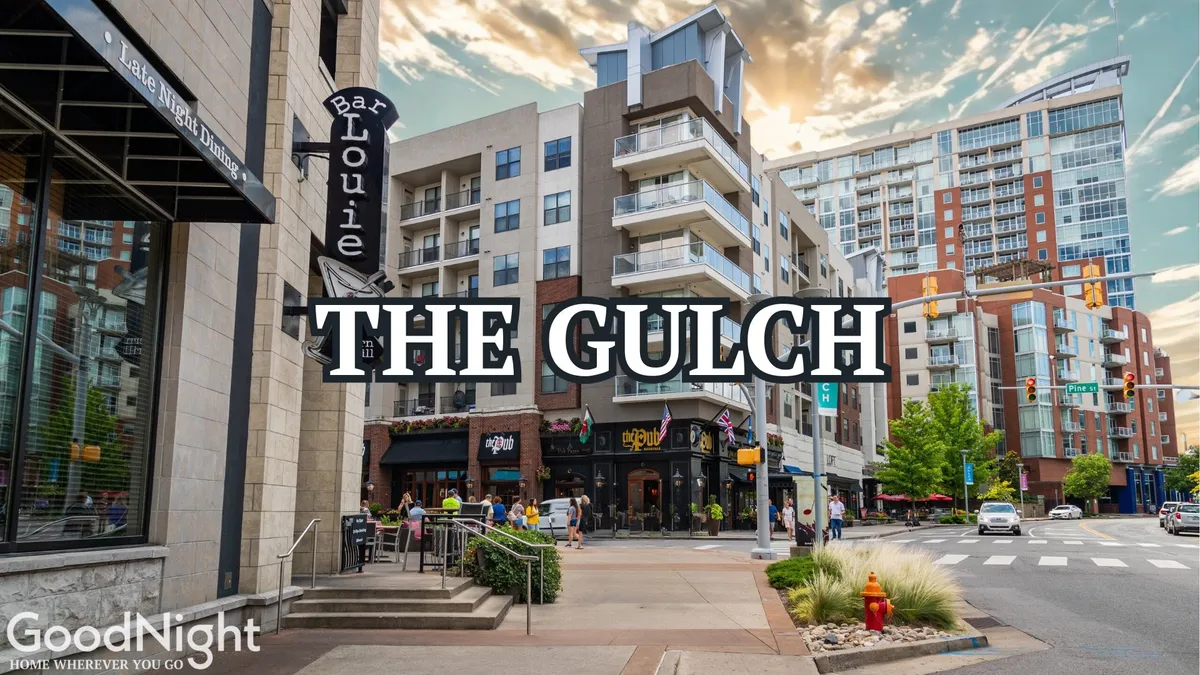 The lively exterior scene showcases Bar Louie, The Gulch sign, modern apartments, and people strolling the energetic sidewalks—a snapshot of the vibrant urban lifestyle, replete with live music, food festivals, and social gatherings that define the area.