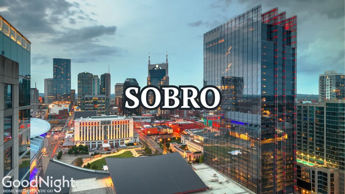 A breathtaking dusk view of the city skyline with tall buildings, the SOBO sign, and a glowing sky, capturing the transition from day to night—a time when the city’s nightlife comes alive. The scene buzzes with the promise of evening adventures, dining, concerts, and cultural events.